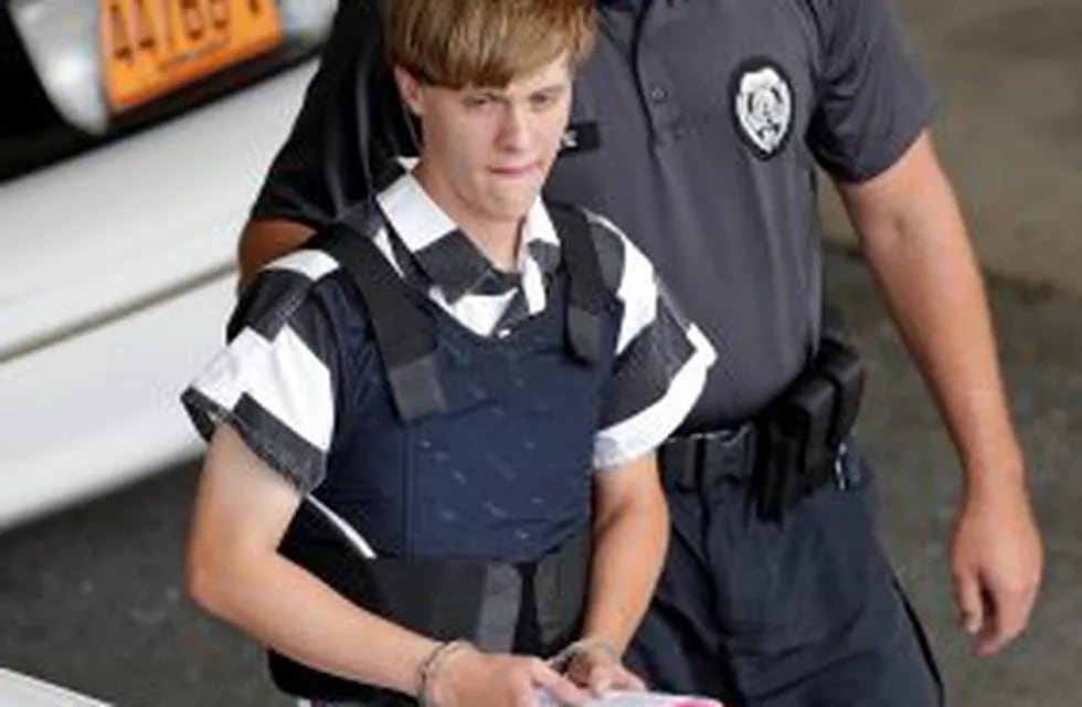 FILE - In this June 18, 2015 file photo, Charleston, S.C., shooting suspect Dylann Roof is escorted from the Cleveland County Courthouse in Shelby, N.C. A federal jury has sentenced Roof to death for killing nine black church members in a racially motivat