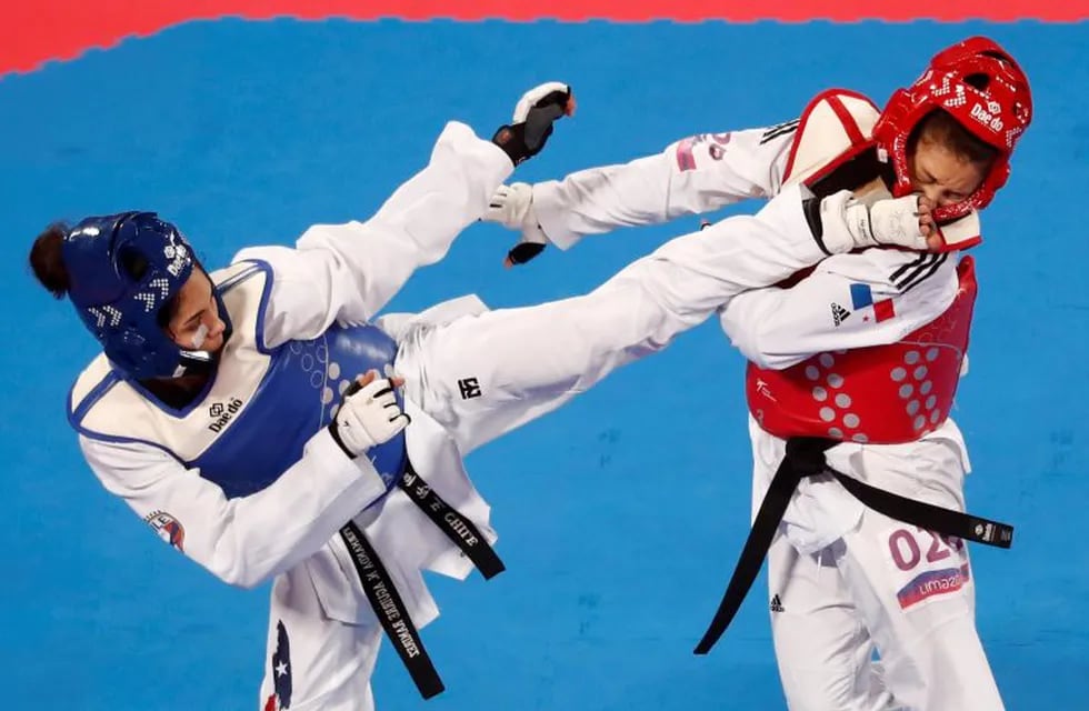 XVIII Pan American Games - Lima 2019 - Taekwondo - Callao Sports Center, Lima, Peru - July 28, 2019. Fernanda Aguirre of Chile competes with Carolena Carstens of Panama during their Women's Under 57kg Bronze Medal match. REUTERS/Susana Vera     TPX IMAGES OF THE DAY