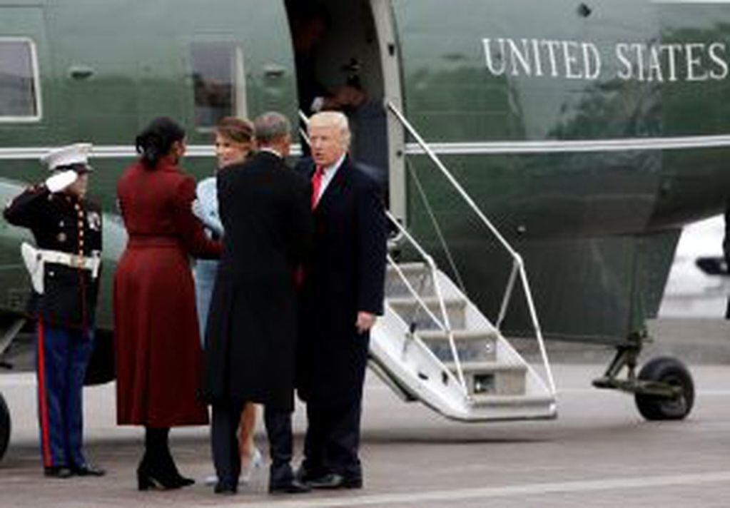 President Donald Trump and first lady Melania Trump talk with former President Barack Obama and Michelle Obama during a departure ceremony on the East Front of the U.S. Capitol in Washington, Friday, Jan. 20, 2017, after Trump was inaugurated. (AP Photo/Evan Vucci)