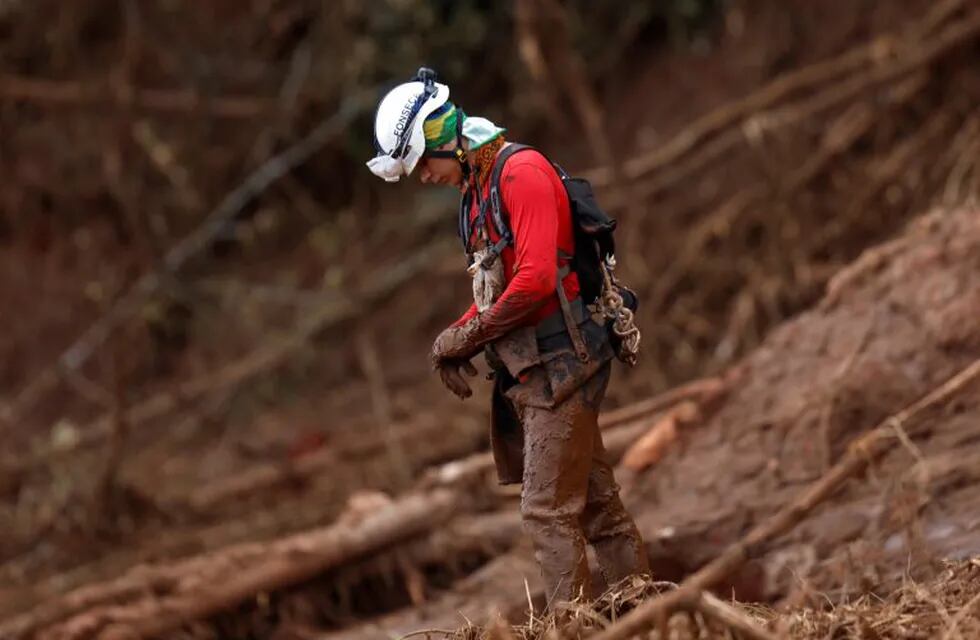 A rescue worker reacts as he attends a mass for victims of a collapsed tailings dam owned by Brazilian mining company Vale SA, in Brumadinho, Brazil February 1, 2019. REUTERS/Adriano Machado