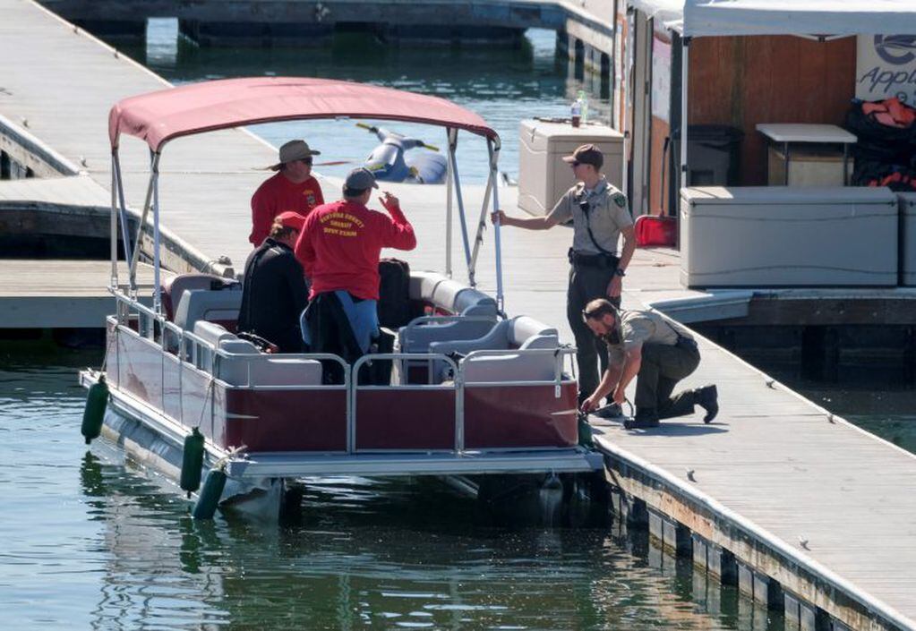 Members of Ventura County Sheriff's Office Underwater Search and Rescue Team help in the search for former "Glee" star Naya Rivera, Thursday, July 9, 2020 in Lake Peru, Calif.  (AP Photo/Ringo H.W. Chiu)