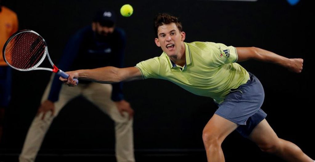 Austria's Dominic Thiem reaches for a return to Argentina's Guido Pella during their first round match at the Australian Open tennis championships in Melbourne, Australia, Tuesday, Jan. 16, 2018. (AP Photo/Vincent Thian)