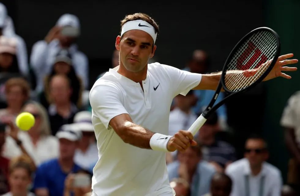 Switzerland's Roger Federer returns to Ukraine's Alexandr Dolgopolov during their Men's Singles Match on day two at the Wimbledon Tennis Championships in London Tuesday, July 4, 2017. (AP Photo/Alastair Grant)