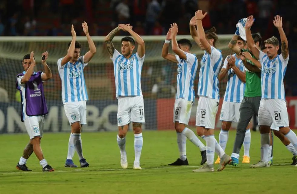 Players of Argentina's Atletico Tucuman applaud at the end of a Copa Libertadores soccer match against Colombia's Independiente Medellin at the Atanasio Girardot stadium in Medellin, Colombia, Tuesday, Feb. 18, 2020. Independent Medellin won 1-0. (AP Photo/Luis Benavides)