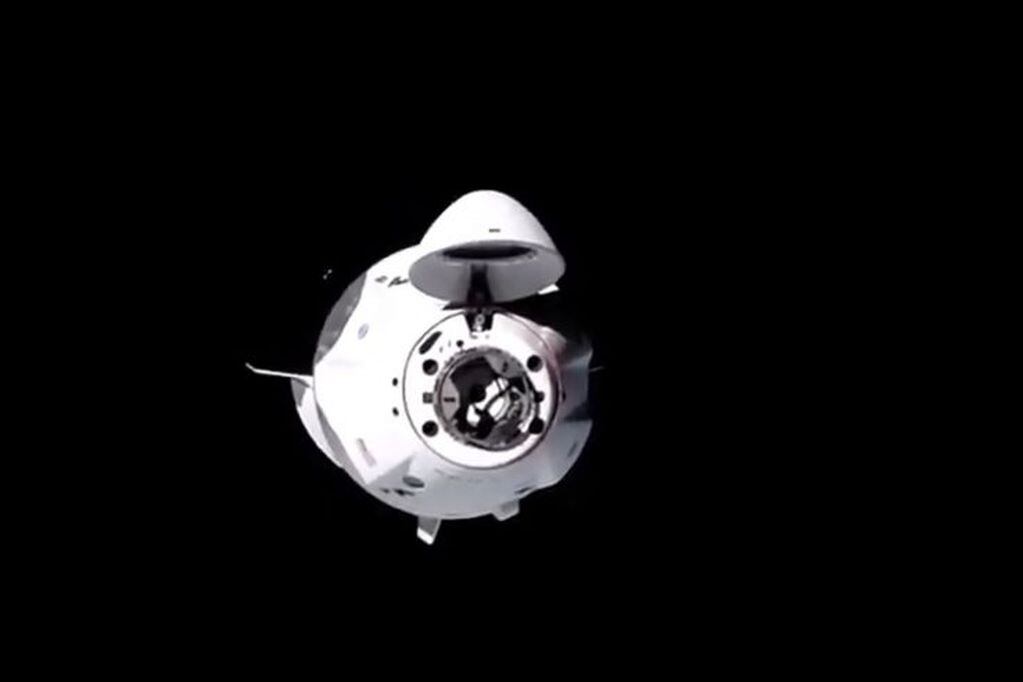 This NASA TV video grab shows Nasa's SpaceX Crew-1 mission aboard the SpaceX Crew Dragon as it approaches the International Space Station (out of frame) on November 16, 2020. - Four astronauts were successfully launched on the SpaceX Crew Dragon \