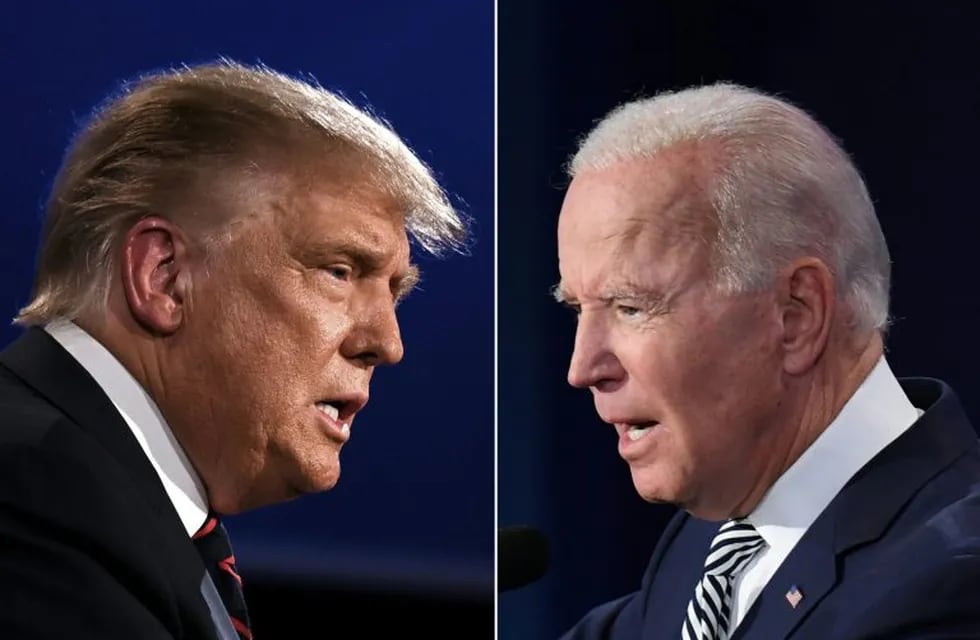 (FILES)(COMBO) This combination of file pictures created on September 29, 2020 shows US President Donald Trump (L) and Democratic Presidential candidate former Vice President Joe Biden squaring off during the first presidential debate at the Case Western Reserve University and Cleveland Clinic in Cleveland, Ohio on September 29, 2020. - Former US vice president Joe Biden has opened up a 16-point national lead over President Donald Trump less than a month before the November 3 presidential election, according to a CNN poll published on October 6, 2020. The Democratic presidential candidate leads the Republican incumbent by 57 percent to 41 percent among likely voters, according to the nationwide CNN poll conducted by SSRS. (Photos by JIM WATSON and SAUL LOEB / AFP)