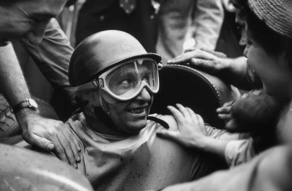 Argentinian racing driver Juan Manuel Fangio (1911 - 1995) wins the British Grand Prix at Silverstone, 14th July 1956. (Photo by George Stroud/Express/Hulton Archive/Getty Images)