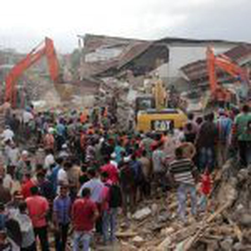 Rescuers use excavators to search for victims under the rubble of collapsed buildings after an earthquake in Pidie Jaya, Aceh province, Indonesia, Wednesday, Dec. 7, 2016. A strong earthquake rocked Indonesia's Aceh province early on Wednesday, killing a large number of people and sparking a frantic rescue effort in the rubble of dozens of collapsed and damaged buildings. (AP Photo/Heri Juanda)