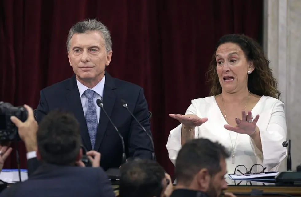 Argentine President Mauricio Macri (L) gestures as Vice President Gabriela Michetti asks photographers to move back, during the inauguration of the 137th period of ordinary sessions at the Congress in Buenos Aires, Argentina on March 1, 2019. (Photo by JUAN MABROMATA / AFP)