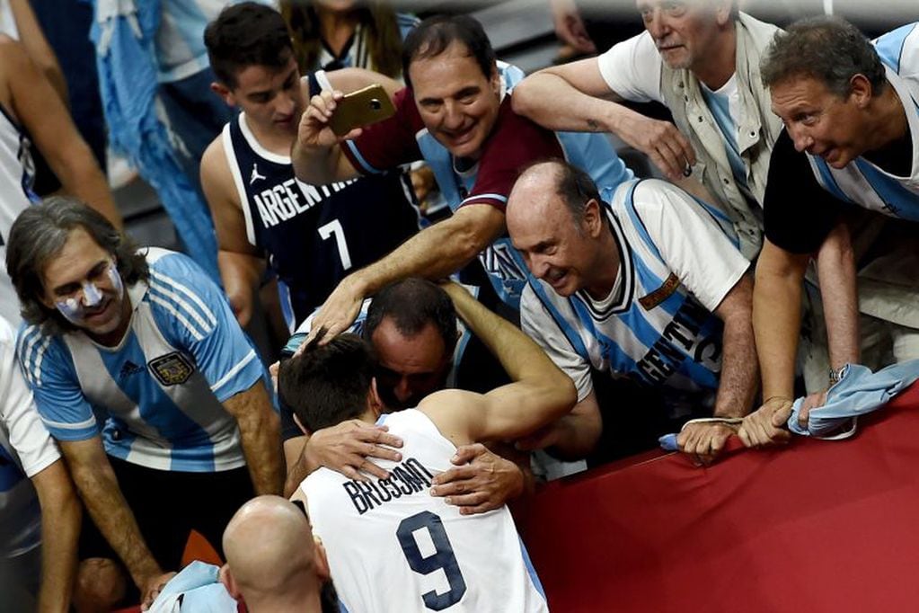 Argentina's Nicolas Brussino celebrates with fans after his team's win against Serbia at the Basketball World Cup quarter-final game in Dongguan on September 10, 2019. (Photo by Ye Aung Thu / AFP)
