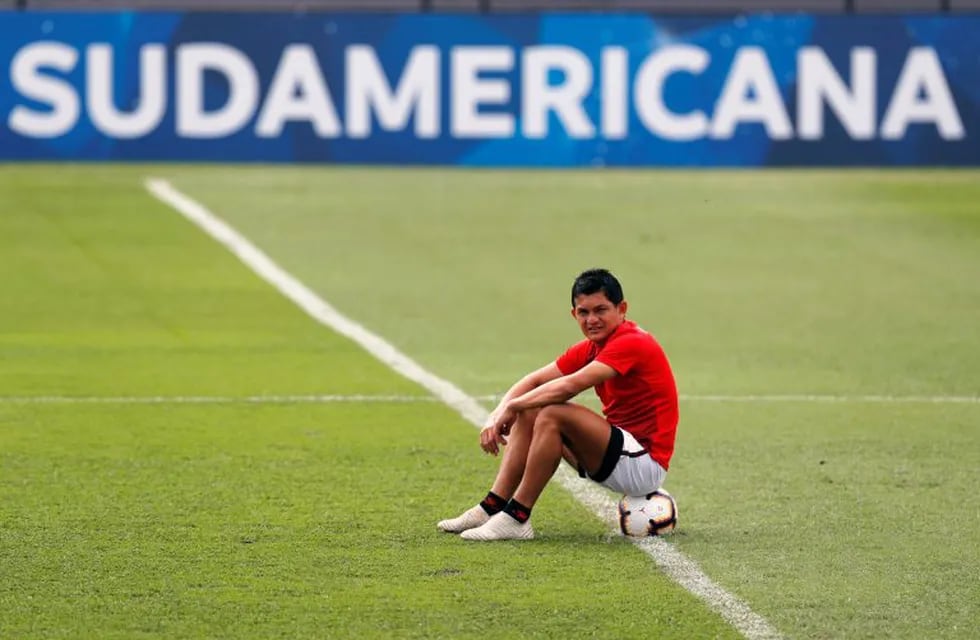Luis Miguel Rodriguez, of Argentina's Colon soccer team, sits on the ball during a training session at Olimpia Stadium in Asuncion, Paraguay, Friday, Nov. 8, 2019. Colon will play Ecuador's Independiente del Valle on Saturday, the final Copa Sudamericana match. (AP Photo/Jorge Saenz)