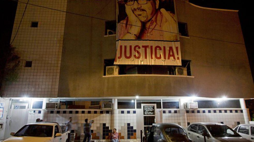 In this July 2, 2017 photo, a banner of slain journalist Javier Valdez and the word in Spanish \