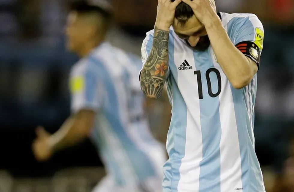 Argentinau2019s Lionel Messi reacts after missing a chance to score during a 2018 Russia World Cup qualifying soccer match between Argentina and Chile at the Monumental stadium in Buenos Aires, Argentina, Thursday March 23, 2017. At left is Argentinau2019s Lionel