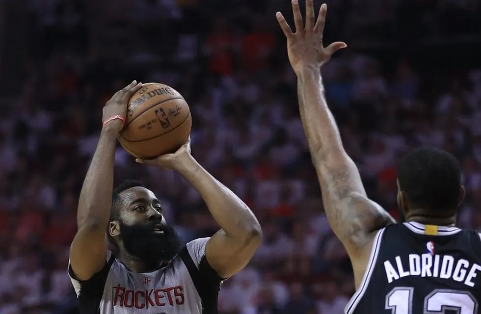 HOUSTON, TX - MAY 07: James Harden #13 of the Houston Rockets shoots against LaMarcus Aldridge #12 of the San Antonio Spurs during Game Three of the NBA Western Conference Semi-Finals at Toyota Center on May 7, 2017 in Houston, Texas. NOTE TO USER: User expressly acknowledges and agrees that, by downloading and or using this photograph, User is consenting to the terms and conditions of the Getty Images License Agreement.   Ronald Martinez/Getty Images/AFPn== FOR NEWSPAPERS, INTERNET, TELCOS & TELEVISION USE ONLY ==