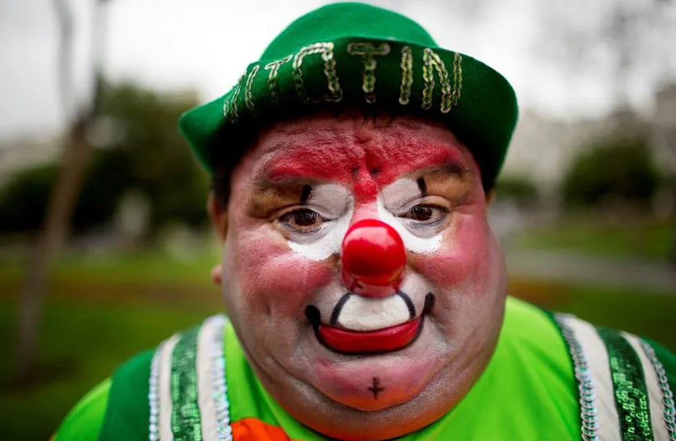 Sorpresa the clown poses for a picture during a march commemorating the Peruvian clown day in Lima Peru, Monday, May 25, 2015. Hundreds of professional clowns dressed in colorful costumes, wigs and face paint marched through the streets of Lima to celebrate Peruvian Clown Day. (AP Photo/Rodrigo Abd) lima peru  dia del payaso peruano festejo festejos celebracion de los payasos gente payasos festejan su dia
