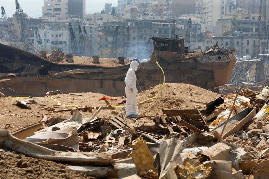 A forensic inspector walks on rubble at the site of Tuesday's blast, at Beirut's port area, Lebanon, August 7, 2020. REUTERS/Mohamed Azakir