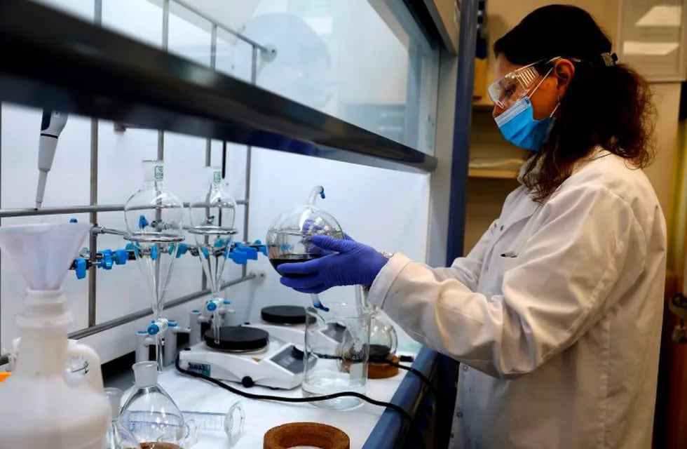 A technician works at the laboratory of NanoScent's headquarters in Misgav industrial zone near the northern Israeli city of Karmiel, on July 21, 2020. - An Israeli company is developing a coronavirus breathalyser test that gives results in 30 seconds, billing it as a \