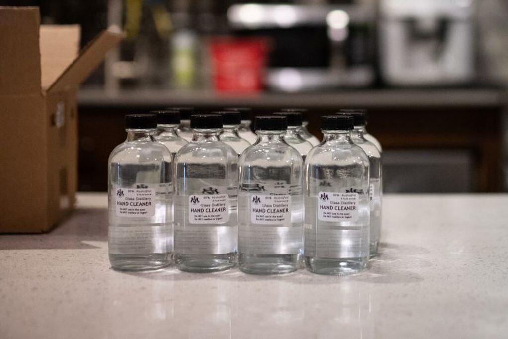 Bottles of hand sanitizer solution made from distilled alcohol byproducts sit on a counter at the Glass Distillery in the SoDo neighborhood of Seattle, Washington, U.S., on Wednesday, March 18, 2020. The Glass Distillery is making their own hand sanitizer and offering it to their customers for free amid the coronavirus pandemic. Photographer: Chona Kasinger/Bloomberg