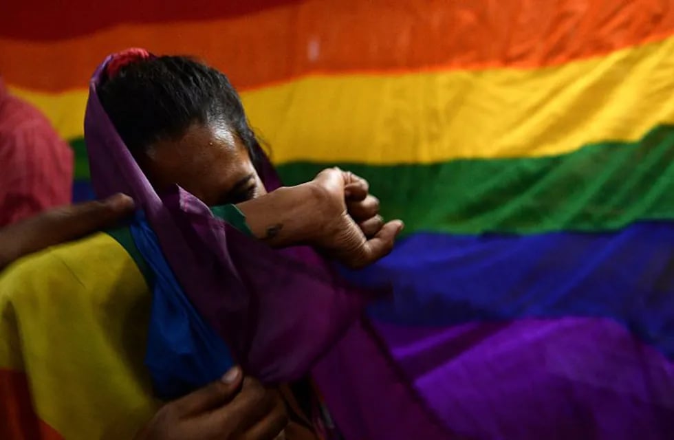 An Indian member and supporters of the lesbian, gay, bisexual, transgender (LGBT) community cries as she celebrates the Supreme Court decision to strike down a colonial-era ban on gay sex, in Chennai on September 6, 2018. - India's Supreme Court on September 6 struck down the ban that has been at the centre of years of legal battles. \