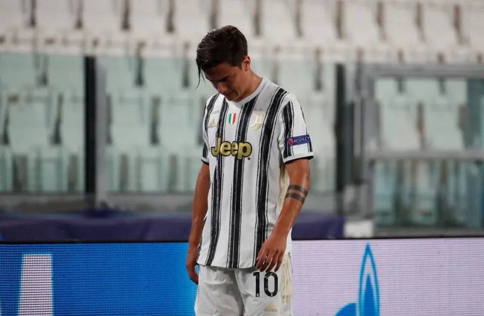 Juventus' Paulo Dybala reacts as he lives the pitch during the Champions League round of 16 second leg, soccer match between Juventus and Lyon at the Allianz stadium in Turin, Italy, Friday, Aug. 7, 2020. (AP Photo/Antonio Calanni)