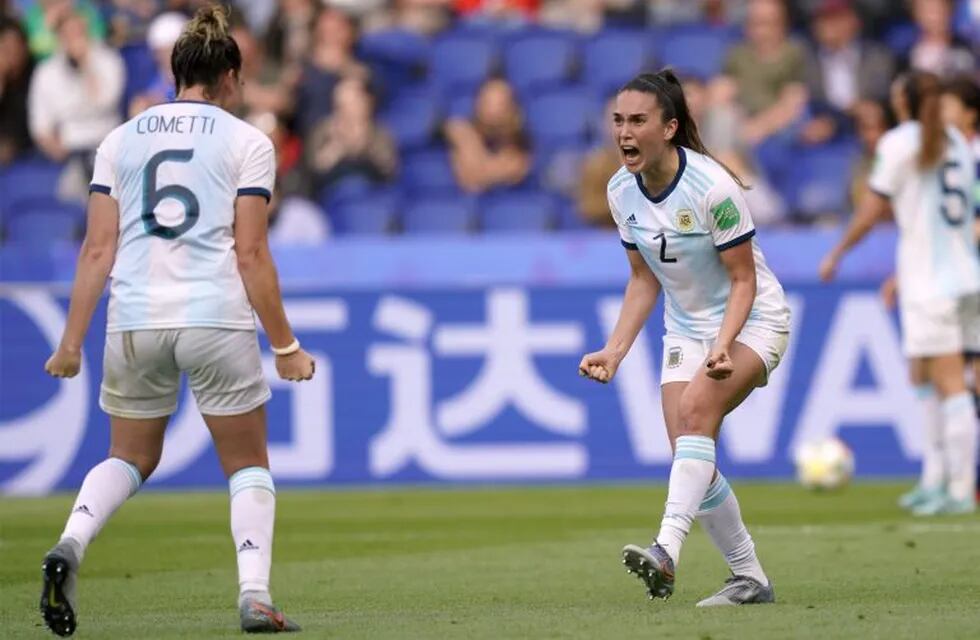 Argentina's defender Agustina Barroso (R) celebrates with Argentina's defender Aldana Cometti at the end of the France 2019 Women's World Cup Group D football match between Argentina and Japan, on June 10, 2019, at the Parc des Princes stadium in Paris. (Photo by Kenzo TRIBOUILLARD / AFP)