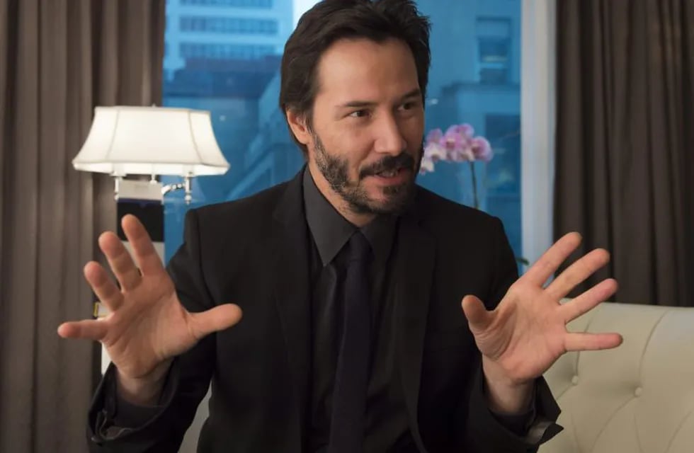 Actor Keanu Reeves gestures during an interview with The Canadian Press in Toronto on Monday October 20, 2014. Reeves stars in the new movie, \