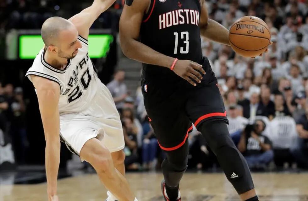 Houston Rockets guard James Harden (13) drives around San Antonio Spurs guard Manu Ginobili (20) during the first half in a second-round NBA playoff series basketball game, Monday, May 1, 2017, in San Antonio. (AP Photo/Eric Gay)