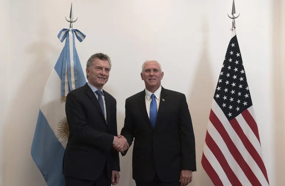 U.S. Vice President Mike Pence, right, poses for a picture with Argentina's President Mauricio Macri at the government residence in Buenos Aires, Argentina, Tuesday, Aug. 15, 2017. Pence is on a official visit to Argentina until Wednesday, when he will be heading to Chile on a week-long visit to Latin America. (Juan Mabromata/POOL photo via AP)