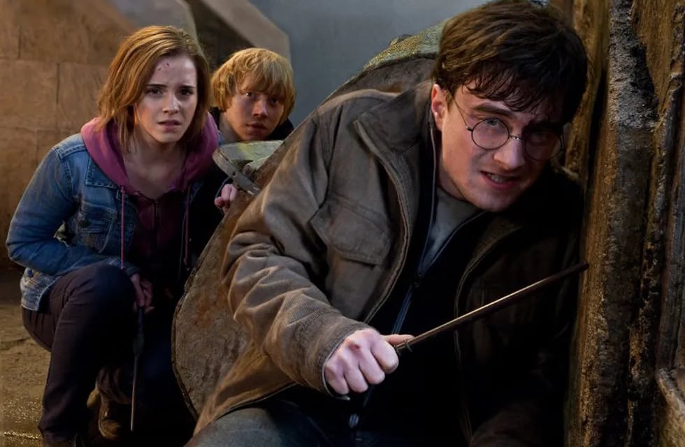 In this film publicity image released by Warner Bros. Pictures, from left, Emma Watson, Rupert Grint and Daniel Radcliffe are shown in a scene from \