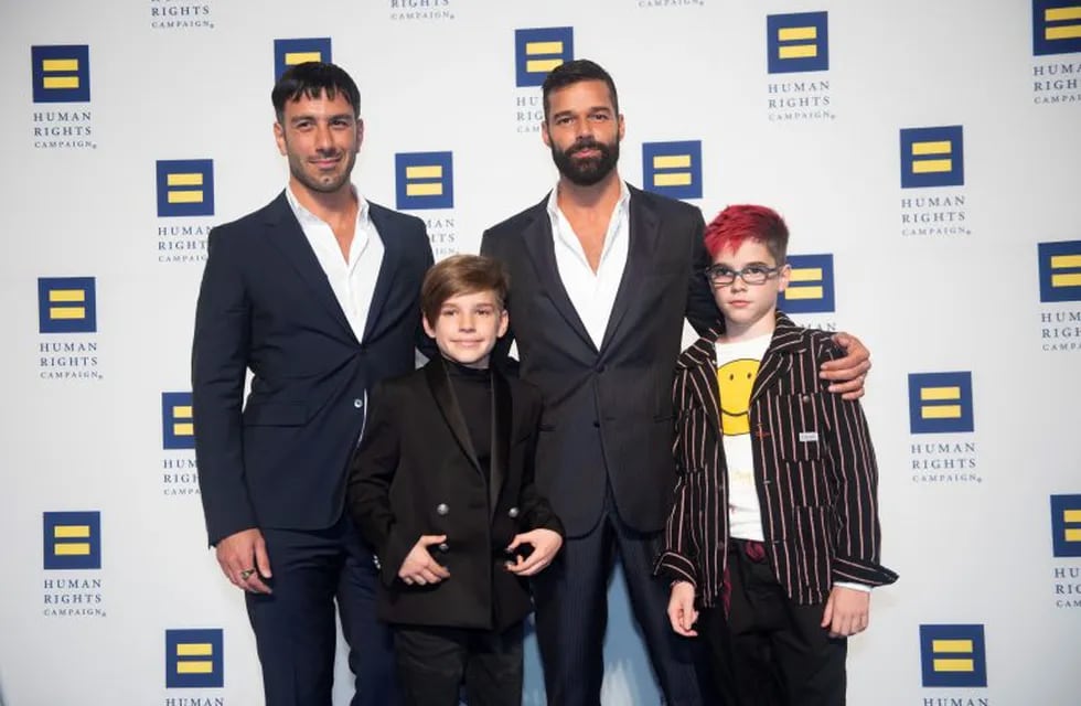 IMAGE DISTRIBUTED FOR THE HUMAN RIGHTS CAMPAIGN - Ricky Martin, his husband Jwan Yosef and their twins arrive at the 2019 Human Rights Campaign National Dinner on Saturday, Sept. 28, 2019 in Washington. While receiving the HRC National Visibility Award, Martin announced he and Yosef are expecting their fourth child. (Kevin Wolf/AP Images for The Human Rights Campaign)