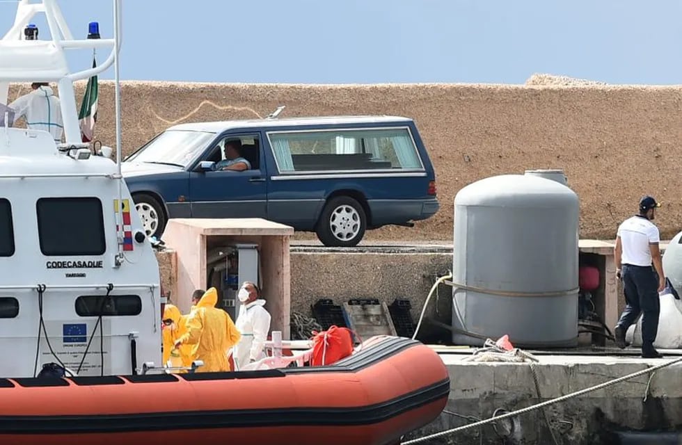 A coffin containing the body of a migrant who died in the shipwreck that took place on October 7 is seen inside a car on the island of Lampedusa, Italy October 18, 2019. REUTERS/Guglielmo Mangiapane