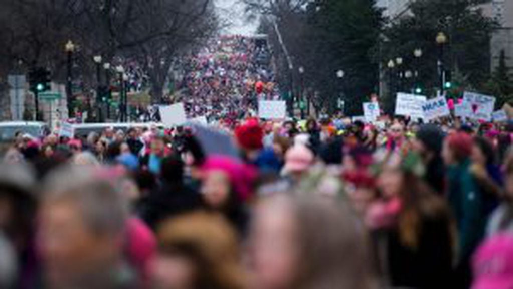 Demonstrators march on the National Mall in Washington, DC, for the Women's march on January 21, 2017.
Hundreds of thousands of protesters spearheaded by women's rights groups demonstrated across the US to send a defiant message to US President Donald Tru