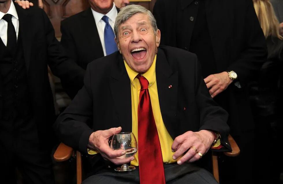 FILE - In this Friday, April 8, 2016, file photo, Jerry Lewis interacts with the press at the Friars Club before his 90th birthday celebration in New York. Lewis, the comedian and director whose fundraising telethons became as famous as his hit movies, has died. Lewis died Sunday, Aug. 20, 2017, according to his publicist. He was 91. (Photo by Brad Barket/Invision/AP, File)