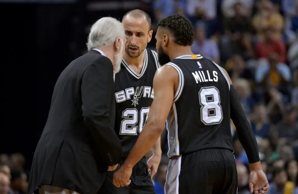 San Antonio Spurs coach Gregg Popovich, left, talks with guards Manu Ginobili (20) and Patty Mills (8) during the second half of Game 6 of the team's NBA basketball first-round playoff series against the Memphis Grizzlies on Thursday, April 27, 2017, in Memphis, Tenn. The Spurs won 103-96 and will advanced to the second round. (AP Photo/Brandon Dill)