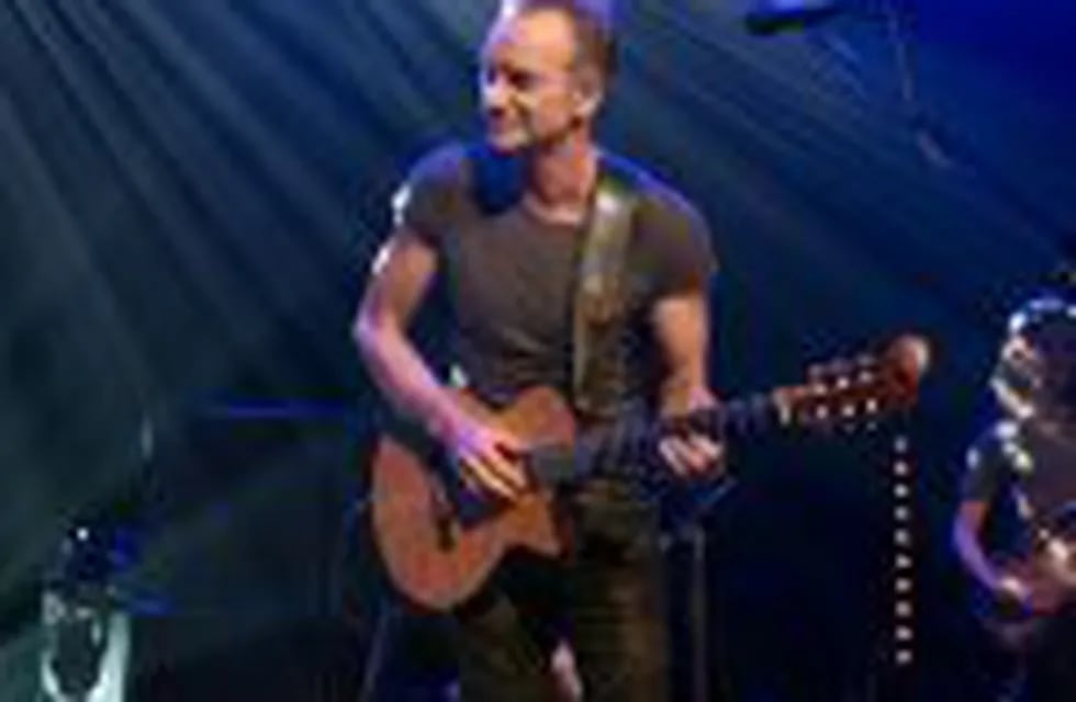 This hand out picture taken and released by David Wolff Patrick on November 12, 2016 at the Bataclan concert hall in Paris shows British musician Sting playing during the reopening concert to mark the first anniversary of the November 13 Paris attacks.rnRock star Sting reopens the Bataclan on November 12, the revered Paris concert hall where jihadists massacred 90 people, with a hugely symbolic show to mark the first anniversary of France's bloodiest terror attacks. Scores of survivors of the Bataclan assault -- the worst of the gun and suicide attacks across the city that night which left 130 dead -- will attend the concert, the dominant event in a weekend of otherwise low-key commemorations. / AFP PHOTO / David Wolff Patrick / HO / RESTRICTED TO EDITORIAL USE - MANDATORY CREDIT 
