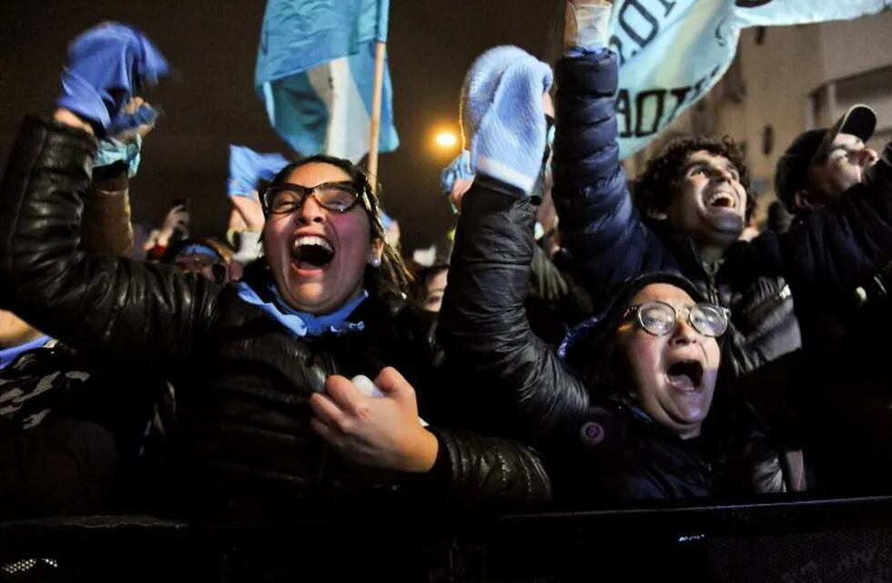 Demonstrators against decriminalizing abortion celebrate outside Congress in Buenos Aires, Argentina, Thursday, Aug. 9, 2018. The Argentine Senate rejected the bill to legalize elective abortion for pregnancies up to 14 weeks. (AP Photo/Luisa Balaguer)