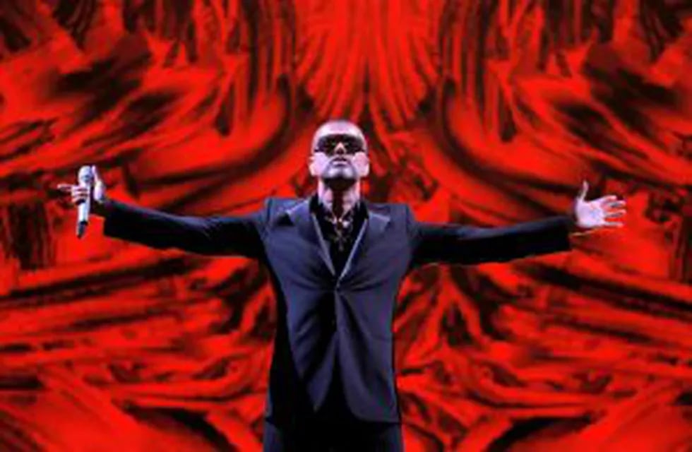 FILE - In this Sept. 9, 2012 file photo, British singer George Michael performs at a concert to raise money for the AIDS charity Sidaction, during the Symphonica tour at Palais Garnier Opera house in Paris, France. Michael, who rocketed to stardom with WH