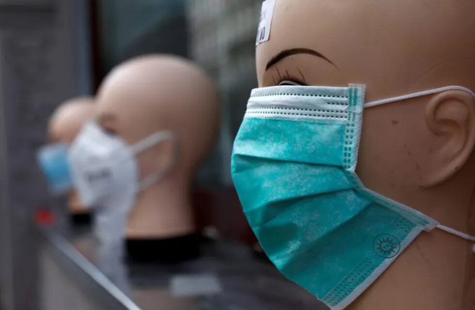 Masks are displayed at a general store, during the outbreak of the coronavirus disease (COVID-19), in the Kreuzberg district of Berlin, Germany, April 3, 2020. REUTERS/Michele Tantussi