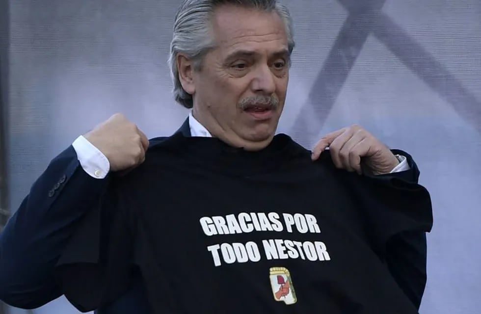 Argentina's presidential candidate for the Frente de Todos party, Alberto Fernandez, holds a jersey reading \