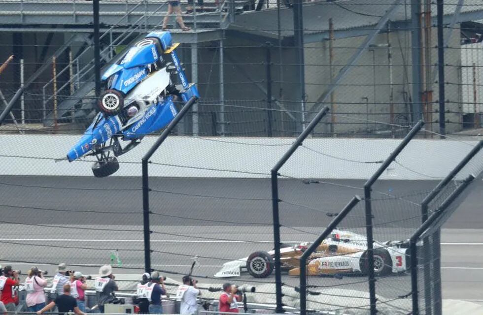 May 28, 2017; Indianapolis, IN, USA; IndyCar Series driver Scott Dixon (9) goes airborne and crashes in front of Helio Castroneves (3) during the 101st Running of the Indianapolis 500 at Indianapolis Motor Speedway. Mandatory Credit: Mark J. Rebilas-USA TODAY Sports     TPX IMAGES OF THE DAY