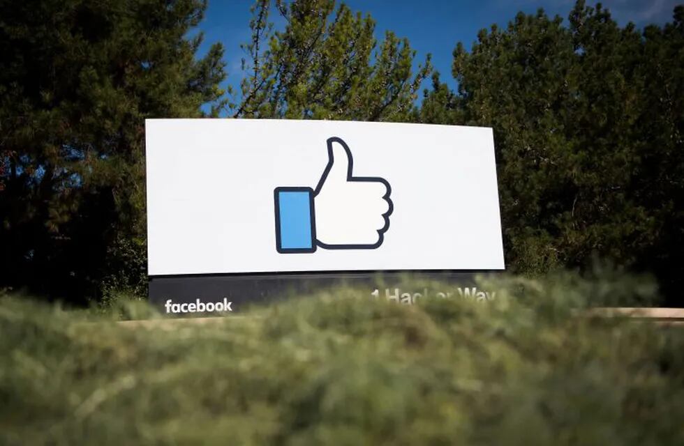 (FILES) This file photo taken on November 4, 2016 shows the Facebook sign and logo in Menlo Park, California. nFacebook said on May 3, 2017, it would add 3,000 people to screen out violent content as the social media giant faces scrutiny for a series of killings and suicides broadcast on its platform. 