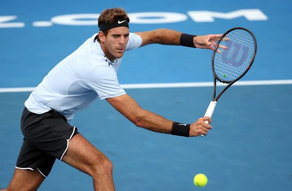 Juan Martin Del Potro of Argentina hits a return during his singles final match against Roberto Bautista Agut of Spain at the ATP Auckland Classic tennis tournament in Auckland on January 13, 2018. / AFP PHOTO / MICHAEL BRADLEY
