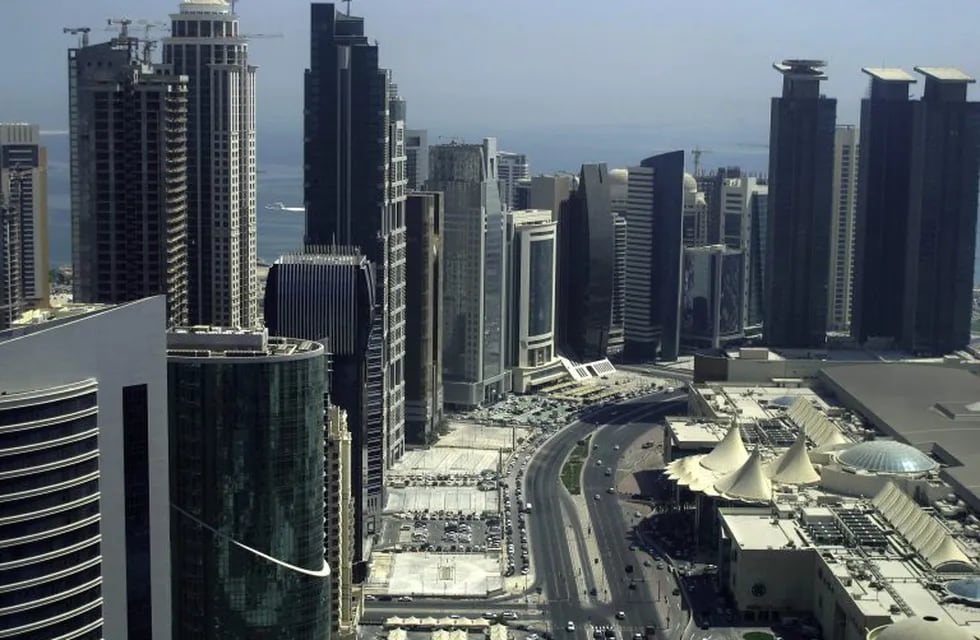 (FILES) This file photo taken on October 4, 2012 shows skyscrapers in the Qatari capital Doha.nGulf states on June 5, 2017, cut diplomatic ties with neighbouring Qatar and kicked it out of a military coalition, less than a month after US President Donald Trump visited the region to cement ties with powerhouse Saudi Arabia.nIn the region's most serious diplomatic crisis in years, Qatar's Gulf neighbours Riyadh, Bahrain and the United Arab Emirates as well as Egypt all announced they were severing ties with gas-rich Qatar. / AFP PHOTO / Patrick BAZ