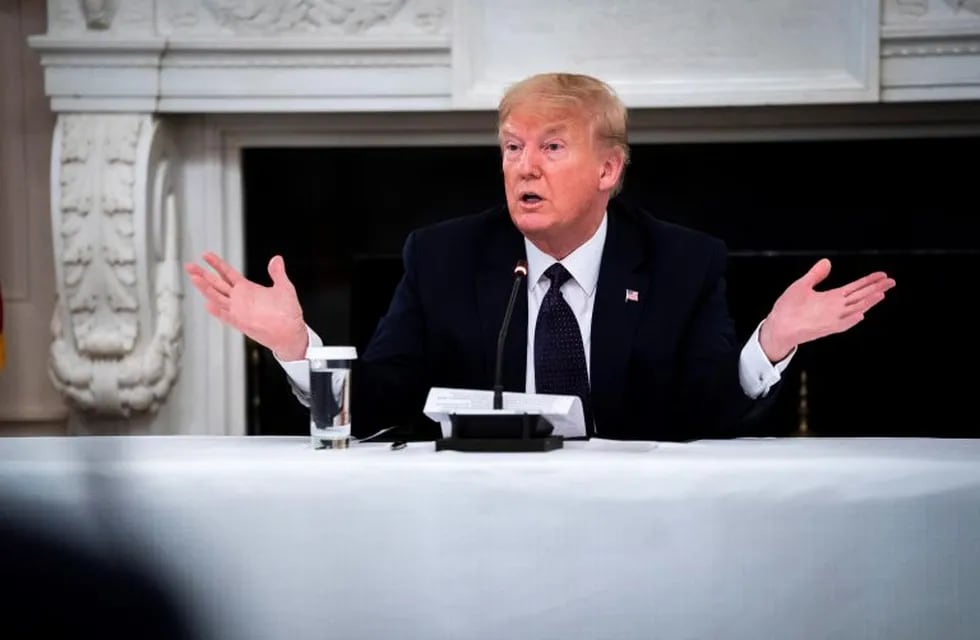 Washington (United States), 18/05/2020.- US President Donald J. Trump reveals that he is taking Hydroxychloroquine prophylaxis against COVID-19 as he participates in a roundtable with Restaurant Executives and Industry Leaders in the State Dining Room, in the White House, Washington, DC, USA, 18 May 2020. (Estados Unidos) EFE/EPA/Doug Mills / POOL