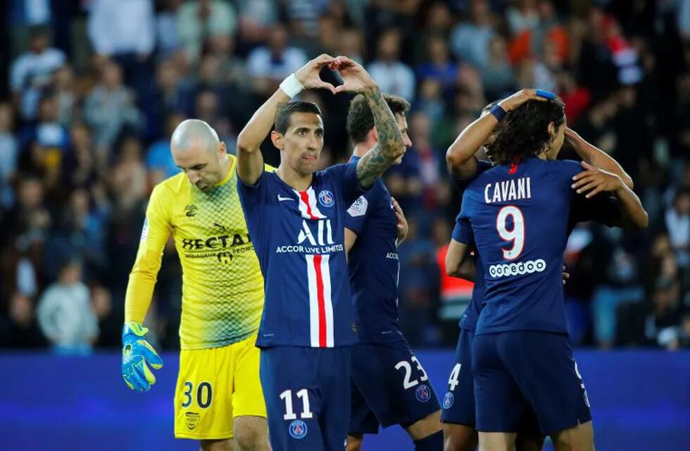 PSG's Angel Di Maria celebrates after scoring his side's third goal during the French League One soccer match between Paris Saint Germain and Nimes at the Parc des Princes Stadium in Paris, Sunday, Aug. 11, 2019. (AP Photo/Francois Mori)