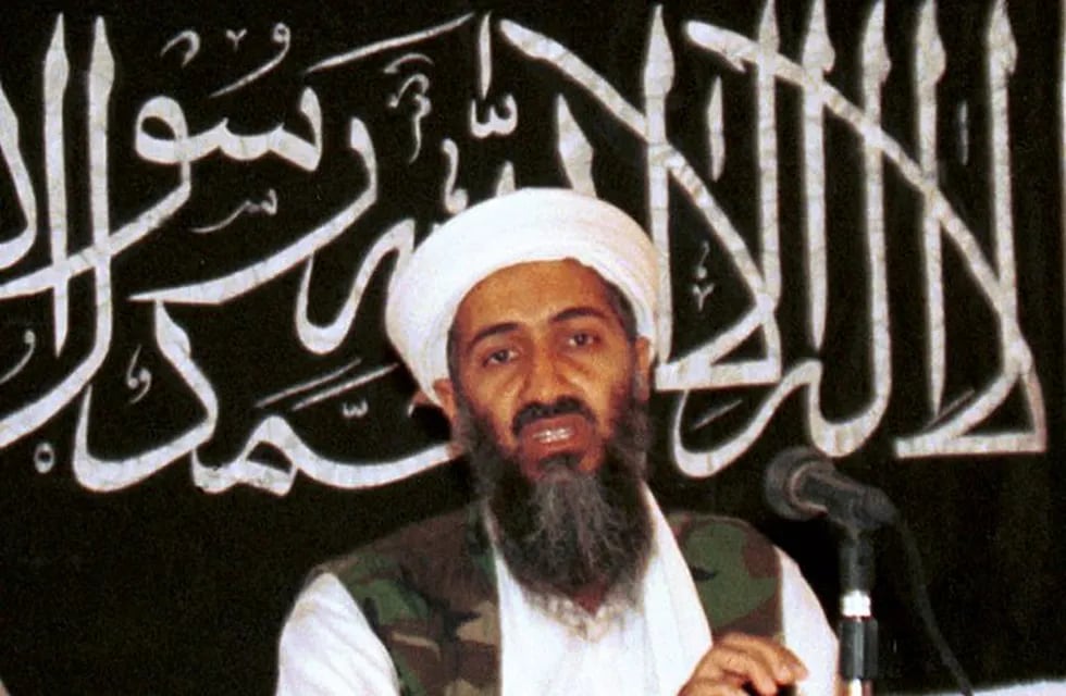 FILE - In this 1998 file photo made available on March 19, 2004, Osama bin Laden is seen at a news conference in Khost, Afghanistan. Never-before seen video of Osama bin Laden’s son and potential successor was released Nov. 1, 2017, by the CIA in a trove of material recovered during the May 2011 raid that killed the al-Qaida leader at his compound in Pakistan. The video offers the first public look at Hamza bin Laden as an adult. Until now, the public has only seen childhood pictures of him. In recent years, al-Qaida has released audio messages from Hamza bin Laden. (AP Photo/Mazhar Ali Khan, File)