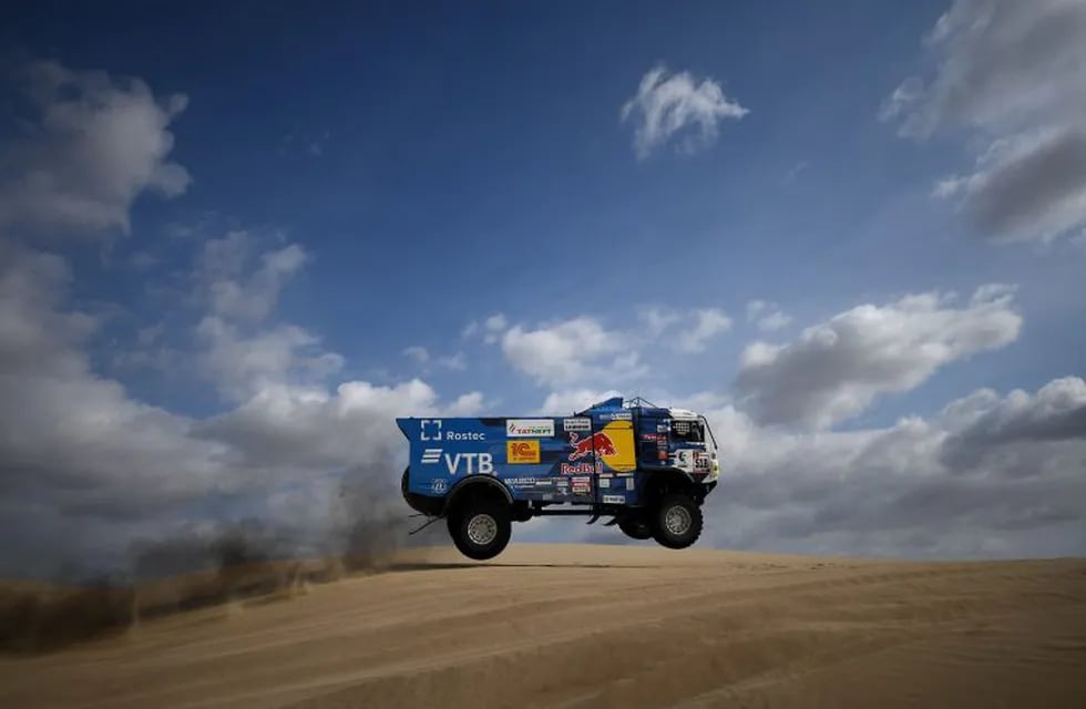 (FILES) In this file picture taken on January 7, 2019 Kamaz' Russian driver Andrey Karginov, co-driver Andrey Mokeev and mechanic Igor Lenonov compete during Stage 1 of the Dakar Rally between Lima and Pisco, Peru. - Karginov's team was disqualified from the race on January 11 after hitting a 60-year-old spectator with the truck during Stage 5 and not stopping to assist him, the Dakar organization informed. The onlooker, who was standing outside a designated spectator zone, suffered a broken femur and was transported by medical staff to a Arequipa's hospital. Kamaz's team said Karginov only learnt about the incident at the end of the stage. (Photo by Franck FIFE / AFP)