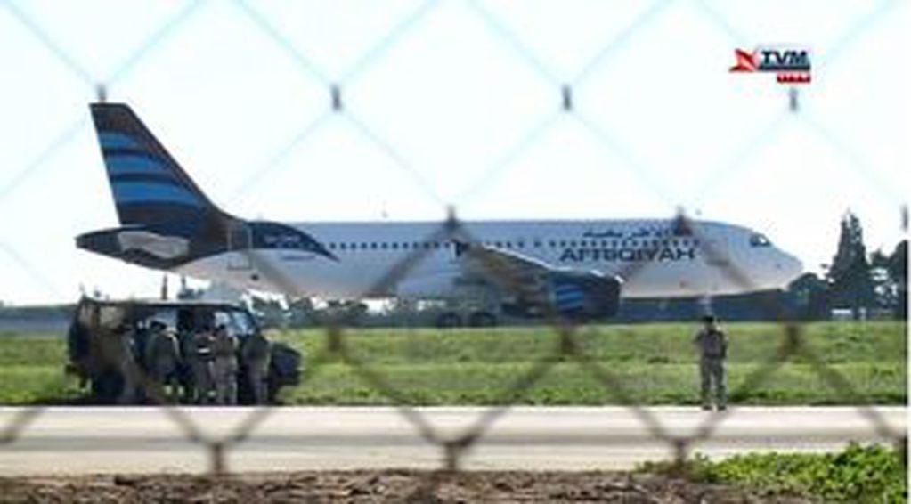 In this frame grab taken from television a hijacked Afriqiyah Airways A320 sits on the tarmac at Malta International airport Friday Dec. 23, 2016. Malta's state television says two hijackers who diverted a Libyan commercial plane to the Mediterranean isla