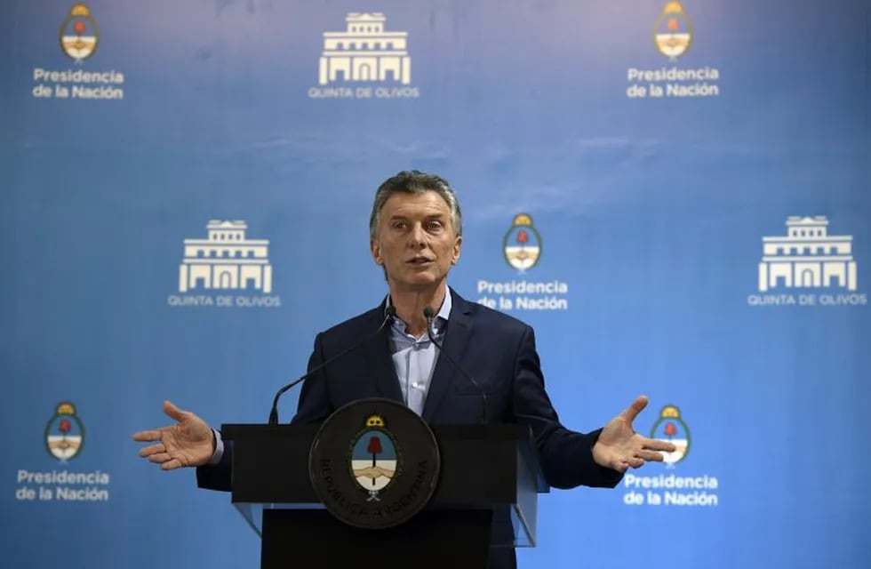 Argentina's President Mauricio Macri speaks during a press conference at the Presidential residence in Olivos, Buenos Aires on May 16, 2018.\r\nMacri said that the government and political leaders should agree to reduce fiscal deficit after considering that the country overcame what he called a \