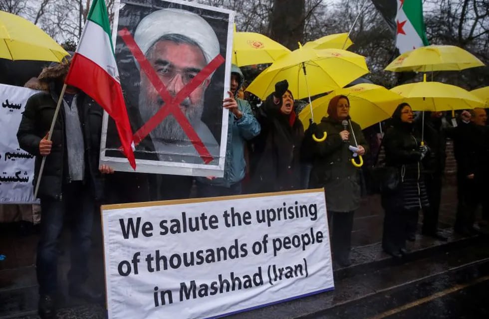 Opponents of Iranian President Hassan Rouhani hold a protest outside the Iranian embassy in west London, December 31, 2017.  REUTERS/Eddie Keogh